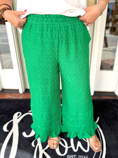 Green wide-leg ruffle pants with a textured pattern