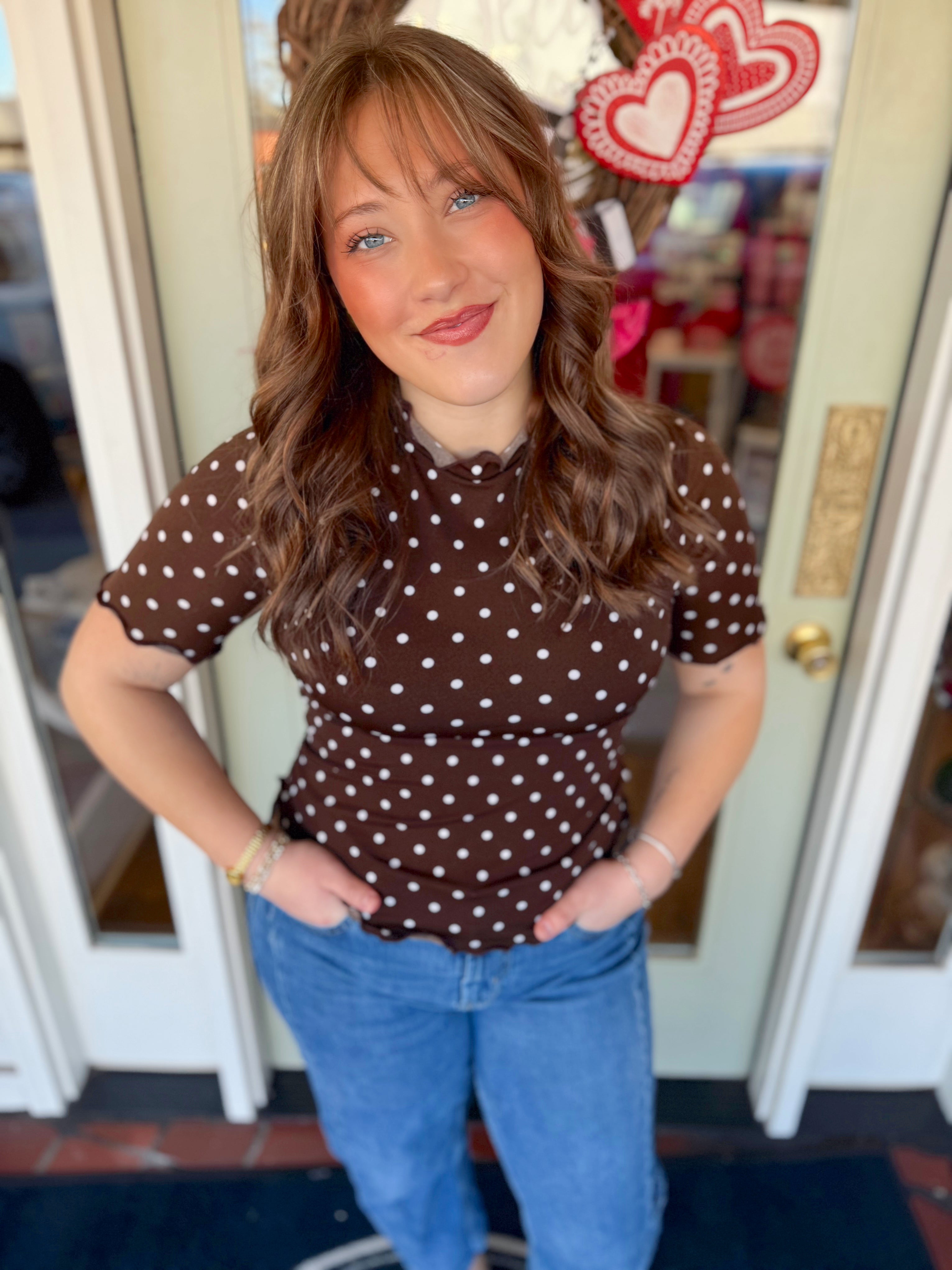 Polka dot fitted top with ruffle trim detail