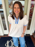 Ivory textured top with dark blue and light blue detailing 