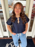 Navy bubble hem sleeve top with decorative gold flowers