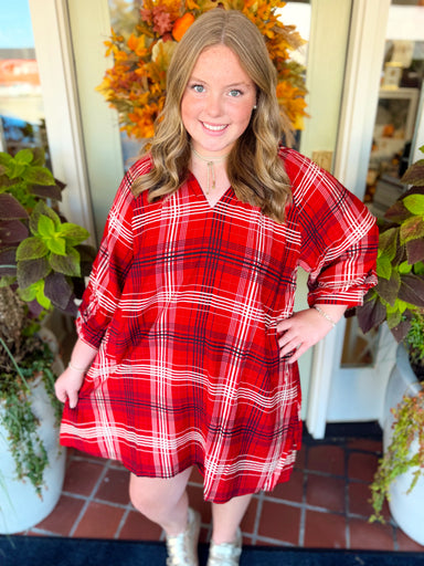 This plaid style features a flattering split V-neckline with a smocked back yoke for added detail and shape.