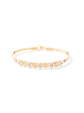 Gold wire bracelet with delicate beaded floral design featuring small white beads, handcrafted with an elegant and timeless style.