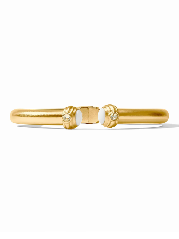 Gold bracelet with two circular links on a white background