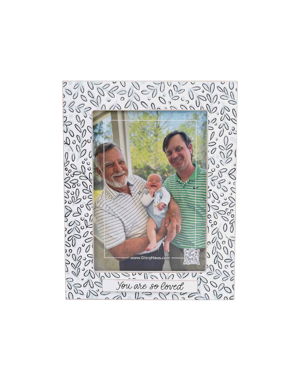 Decorative photo frame with a floral pattern.