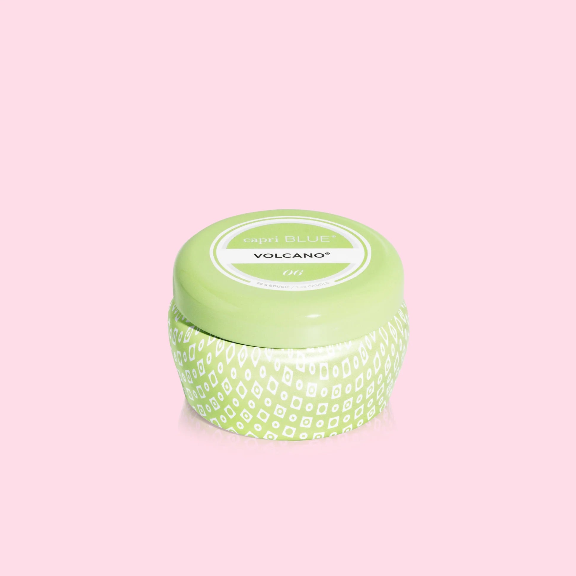 A small green volcano scented candle by capri blue