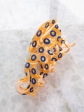 Decorative orange and blue octopus-hair clip
